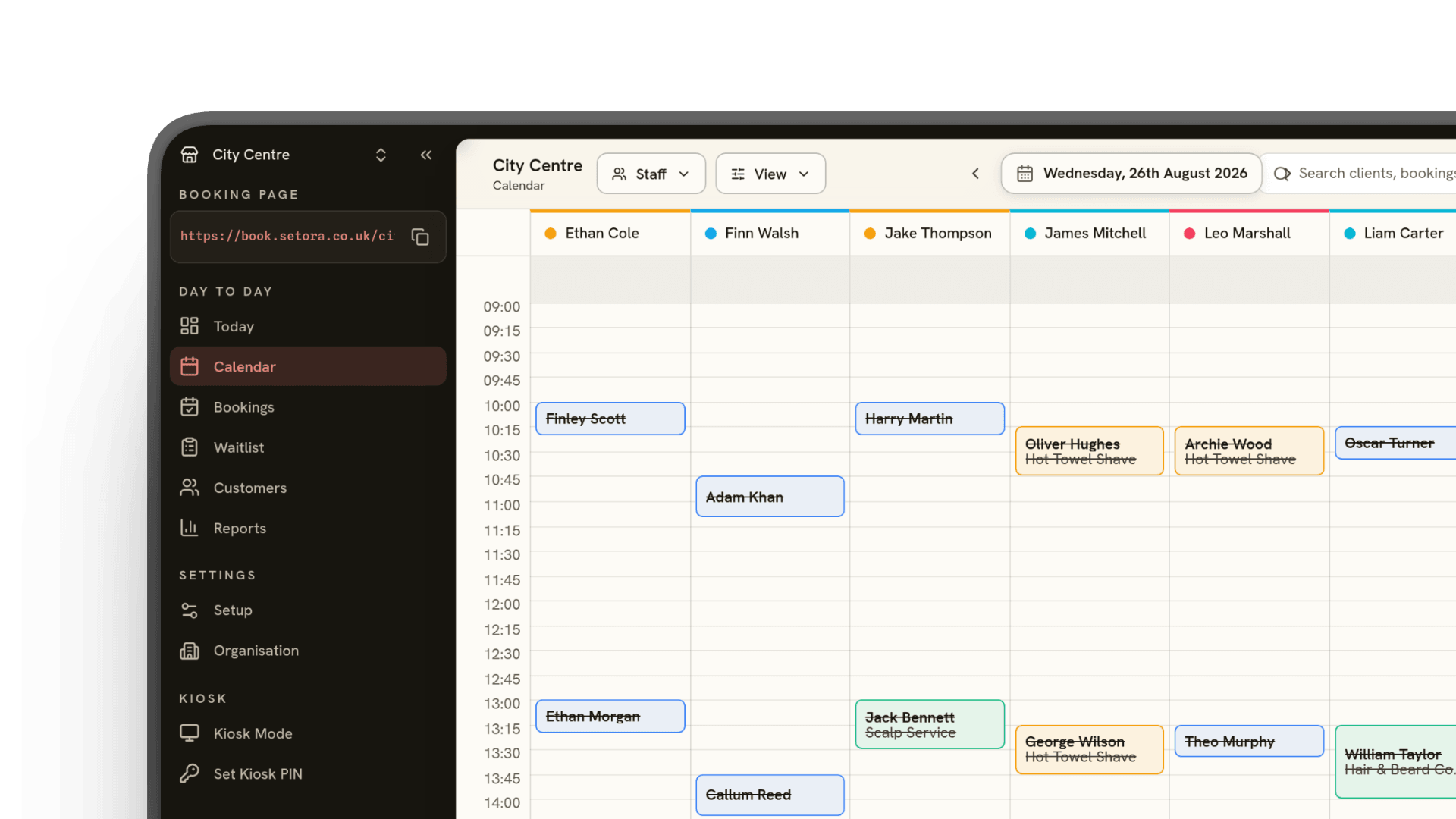 Setora's day calendar for a barbershop, showing six staff columns and appointments arranged across the day